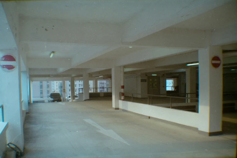 empty building with one window, only door and a couch