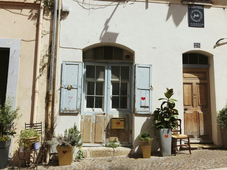 a building with doors on each side and windows