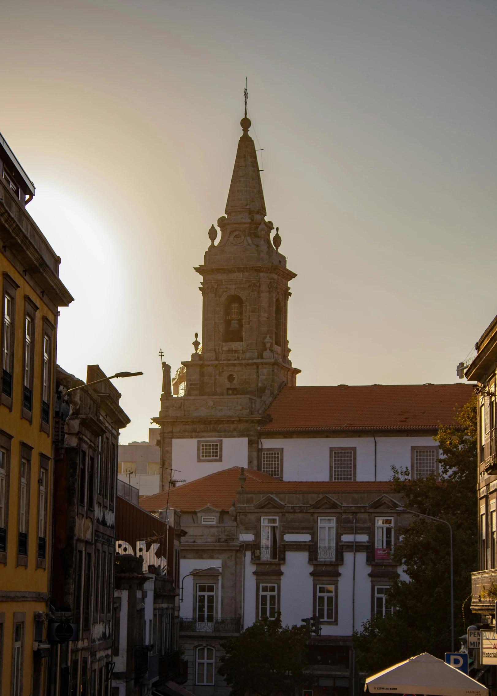 an old building is shown behind a street