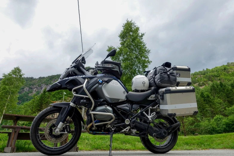 a black and white motorcycle with bags on it