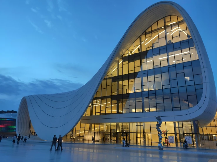 there is a large building with a glass facade