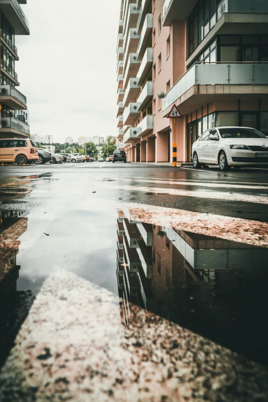 a dle of water in front of a city street