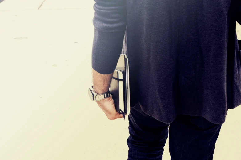 a man holding his hand on his pocket