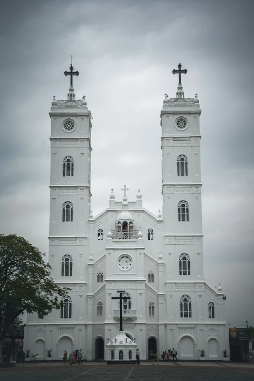 a large white church with multiple towers in front of it