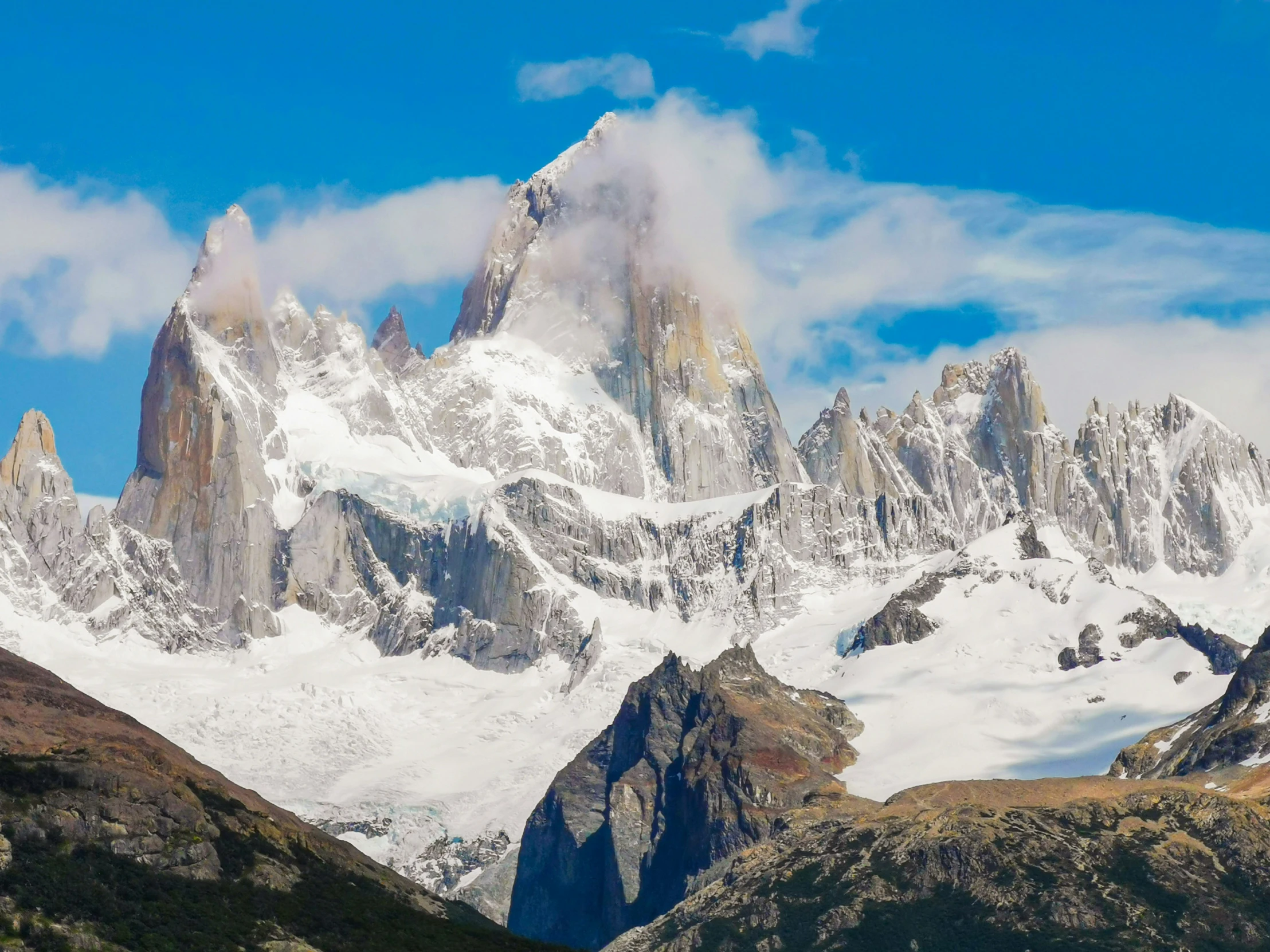 a view of snowy mountains in the distance