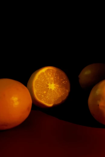 the oranges are next to each other on a table