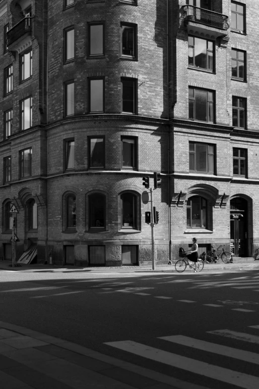 a very tall brick building sitting next to a street