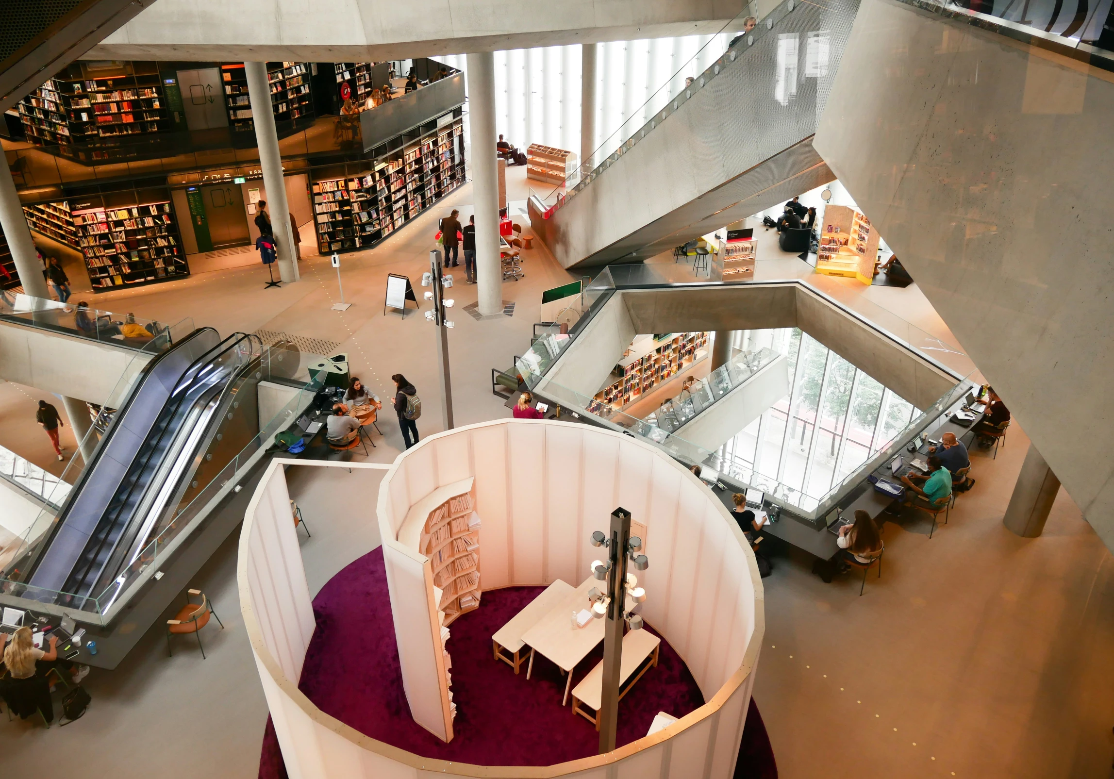 a large, spiral stair case in an indoor mall