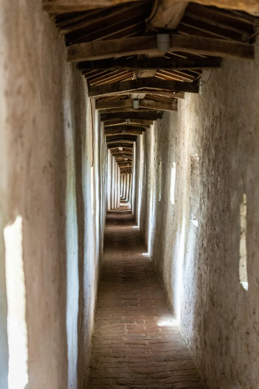 long lines of light shining through the cement walkways