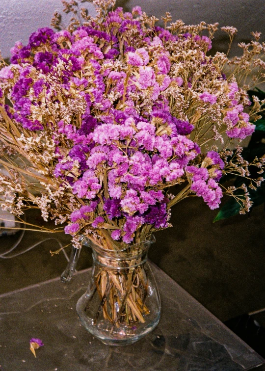 a bouquet of lavenders on display inside a glass vase