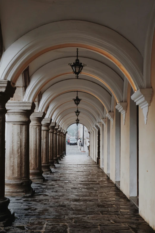 a street that has a row of columns on both sides