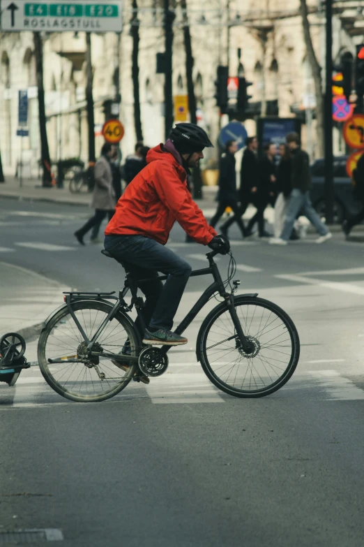 a person riding a bike on the side of the road