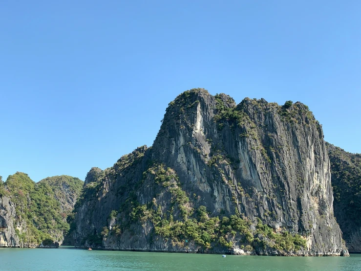 an island made of large rocks in the middle of a body of water