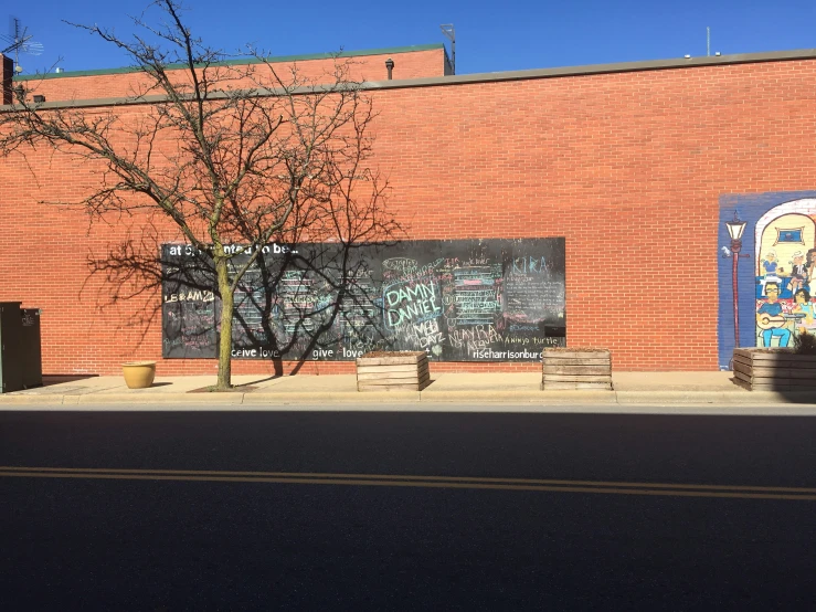 a brick building has graffiti on it