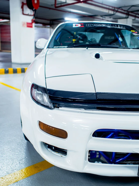 a car sits parked in a parking garage