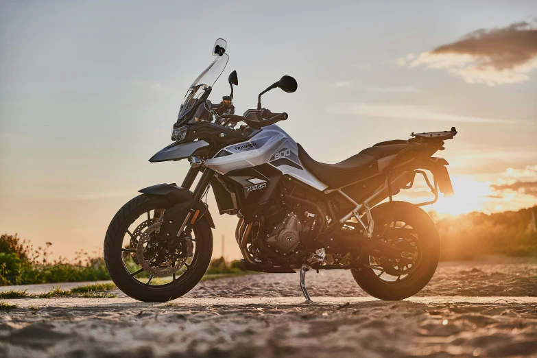 a motorcyclist with a helmet and motorcycle on the road