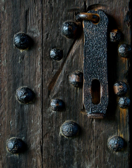 an old door that has some s and iron
