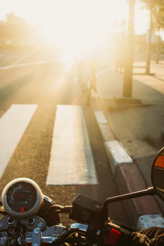 the bike is parked in front of the street crosswalk