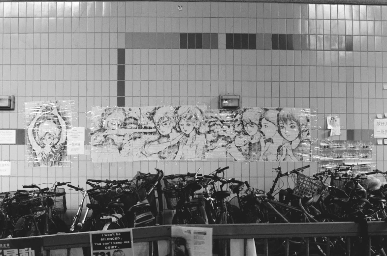 there is a large wall of bicycles in the middle of the room