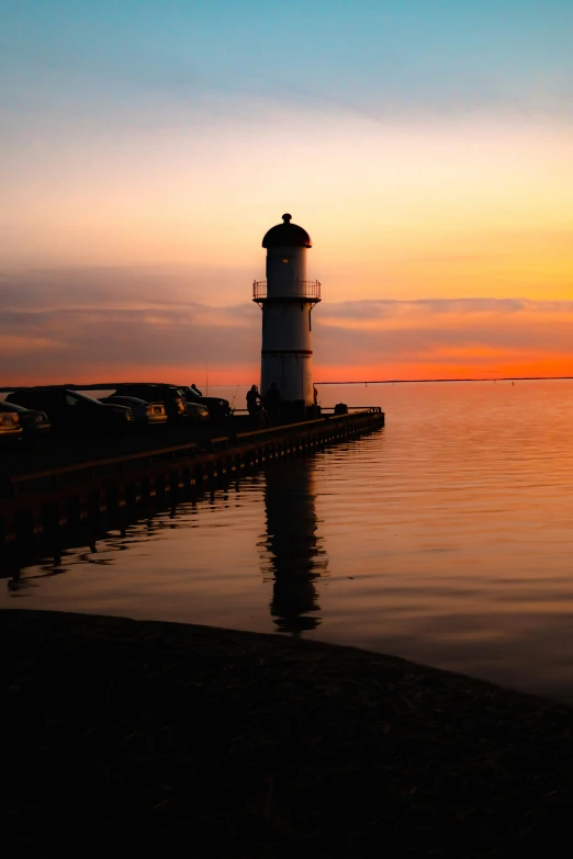 an image of a light house at sunset