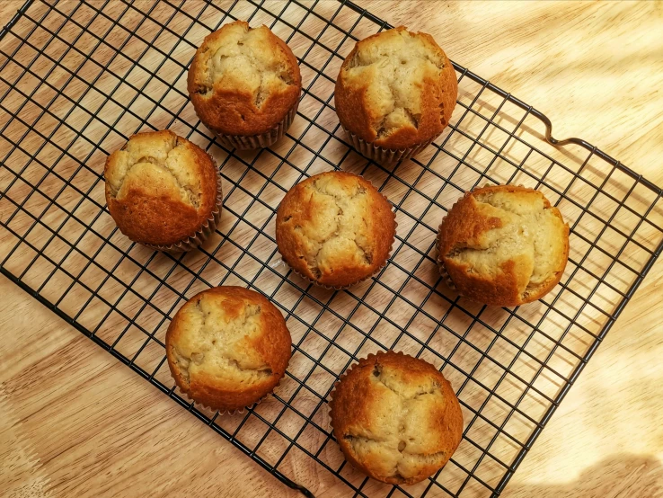 eight muffins on top of a cooling rack