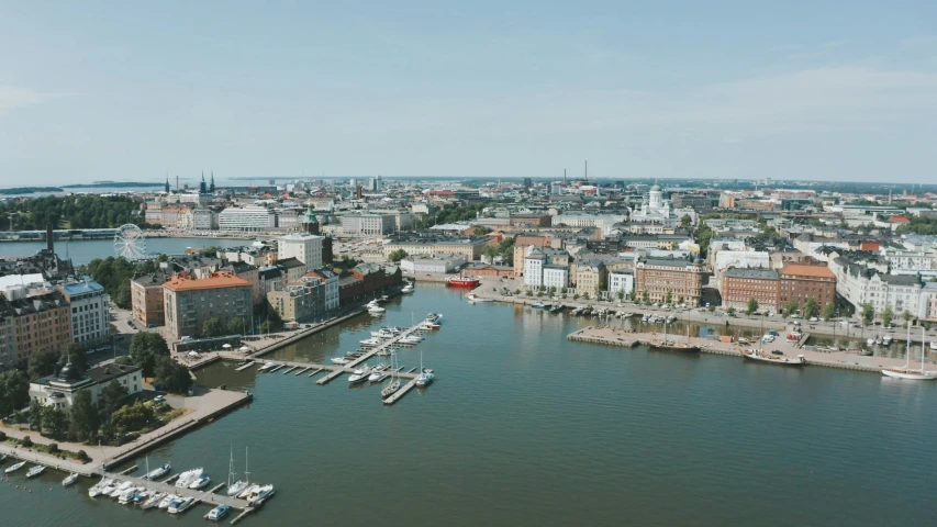 several boats parked along the water in a city