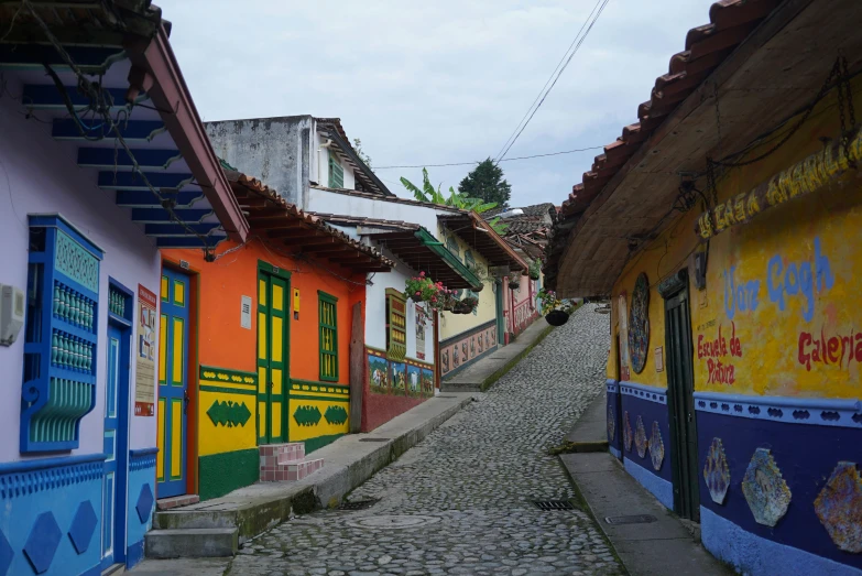 a street with lots of colorful houses on both sides