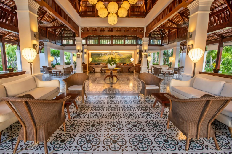 this el lobby is decorated with white wicker furniture