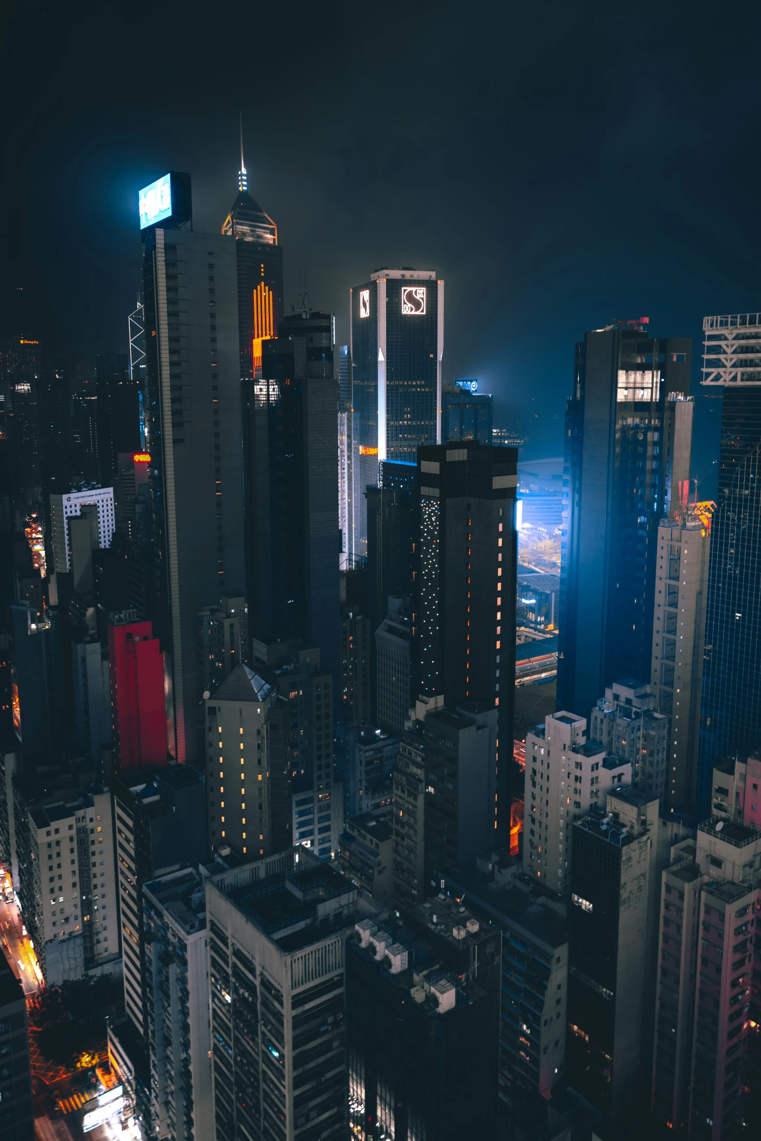 city at night with city lights and tall buildings