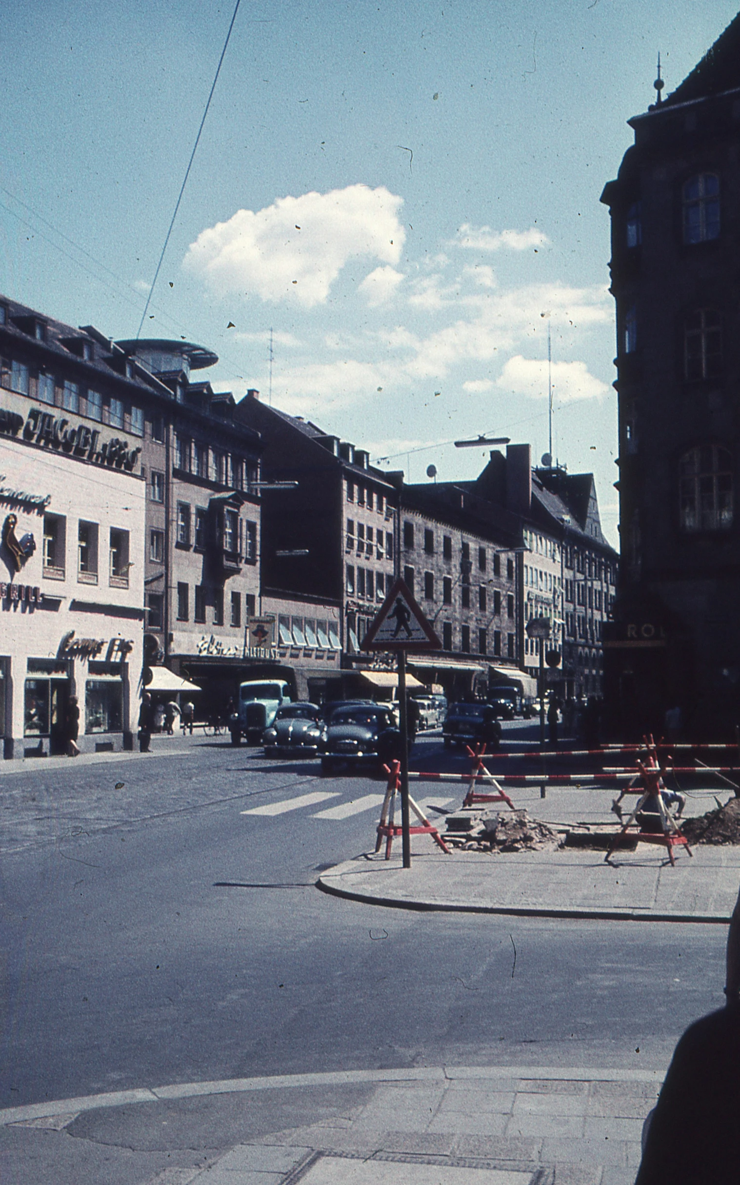 a city street with buildings and construction work