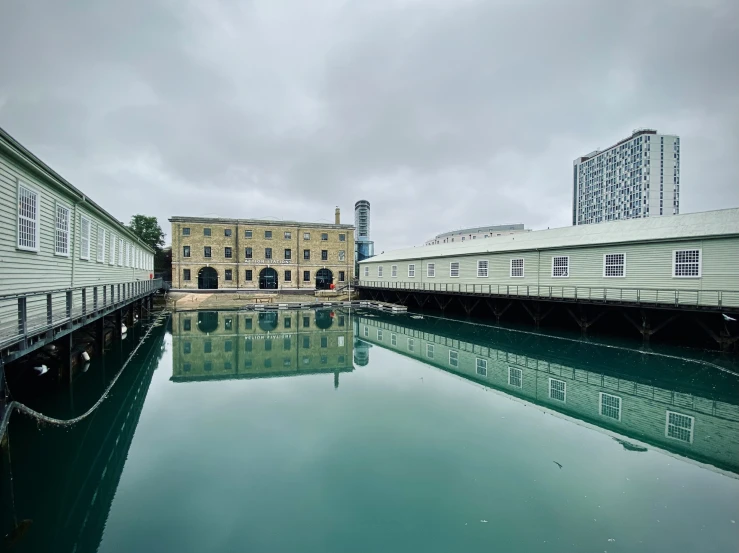 buildings next to water in front of an open building