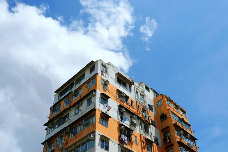 a tall building has balconies on the second floor