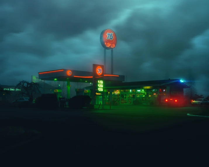a night time scene of an empty gas station