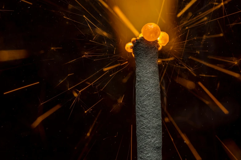 the top of a tall tower with fireworks around it