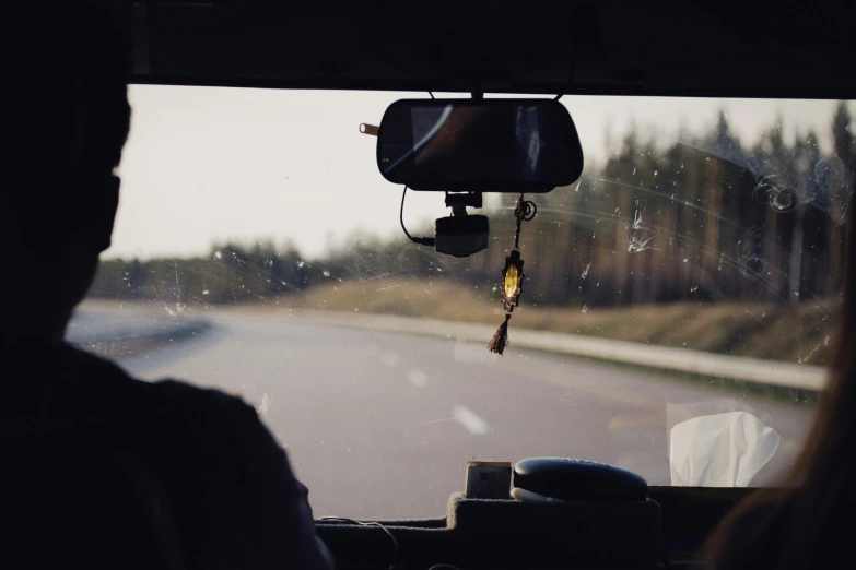 a view from inside of a vehicle through the windshield