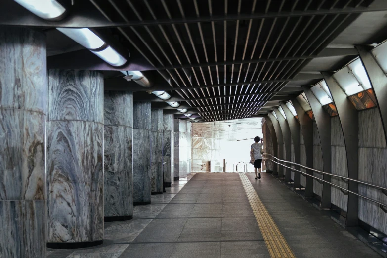 a long walkway with some people on the way