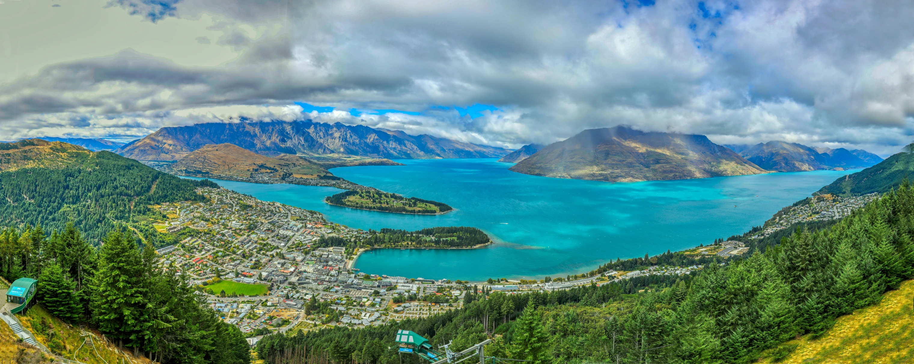 a landscape po looking down at a bay in the middle of a mountain range