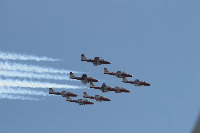 five planes are flying in the sky together