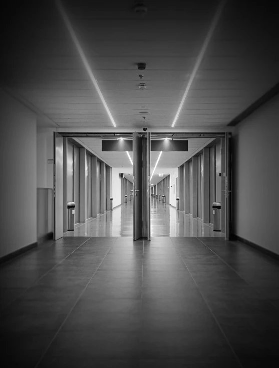 a hallway leading to three sets of elevators