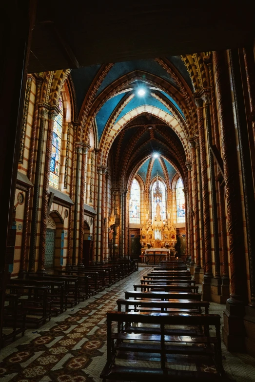 a cathedral lit by sunbeams from the doorway