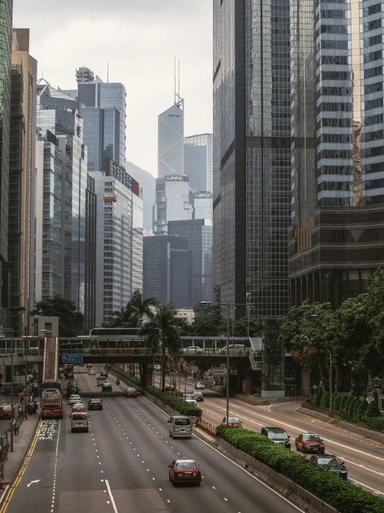 a group of cars driving in a busy city