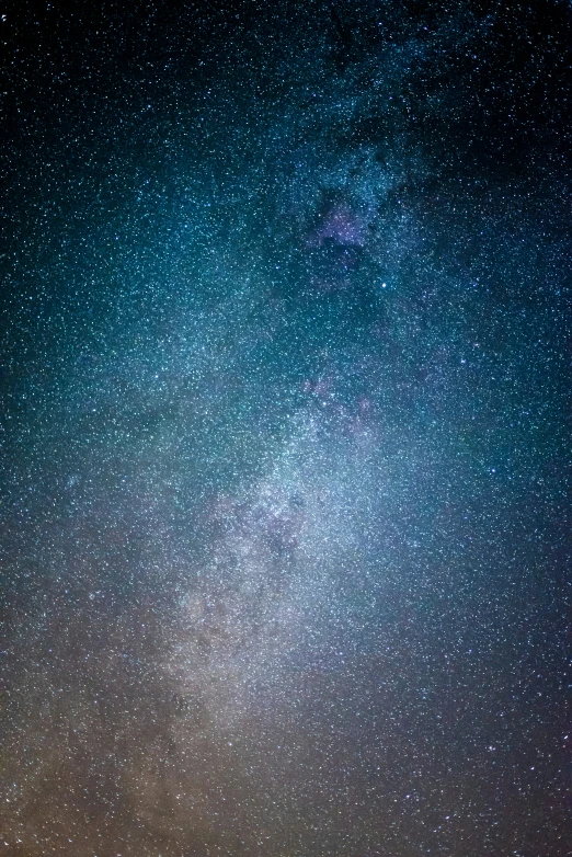 two people standing together watching the stars in the sky