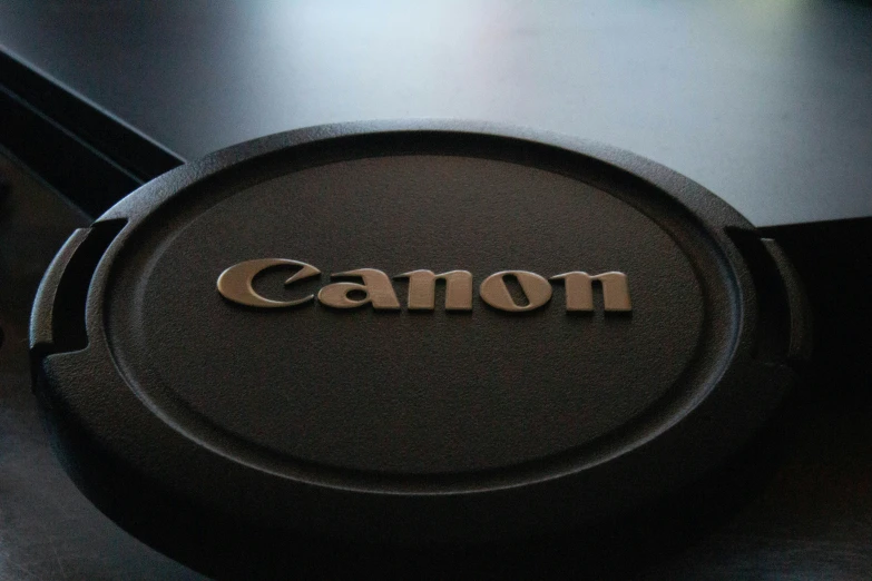 the canon logo on top of a camera