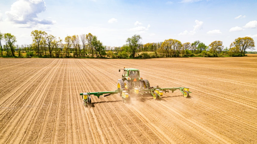 an overhead view of a tractor pulling a plow