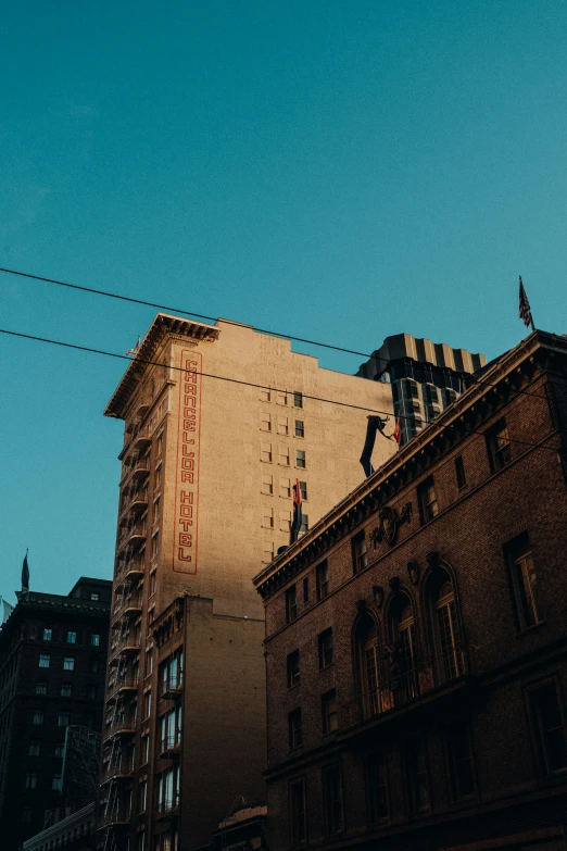 a tall building with some buildings under it