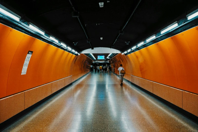 a brightly colored hallway with people in it