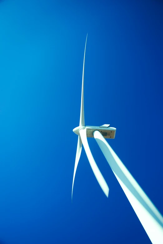 wind turbine in air with sun shining on top