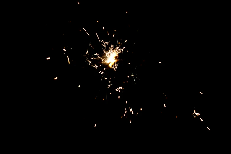 a firework in the dark, showing what appears to be fireworks