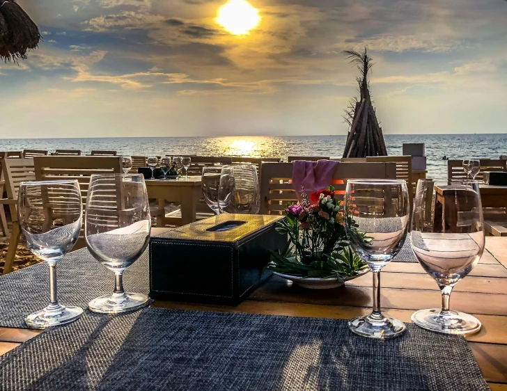 a table with some wine glasses and plates