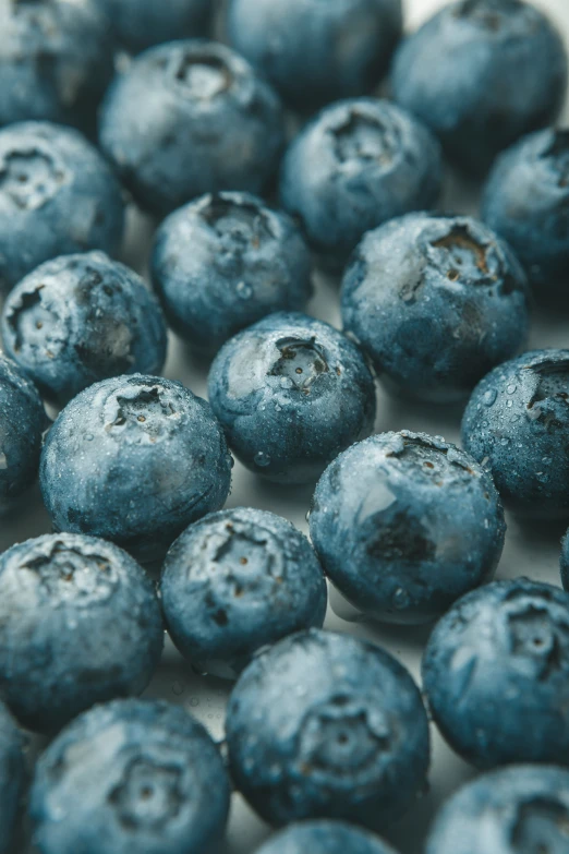 fresh berries are shown in a glass container